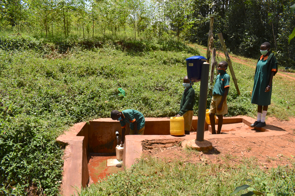 The Water Project : kenya21251-students-collecting-water-1-2