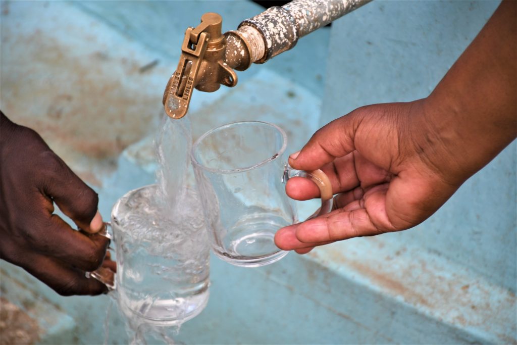 The Water Project : kenya21455-filling-up-a-glass-at-the-tank