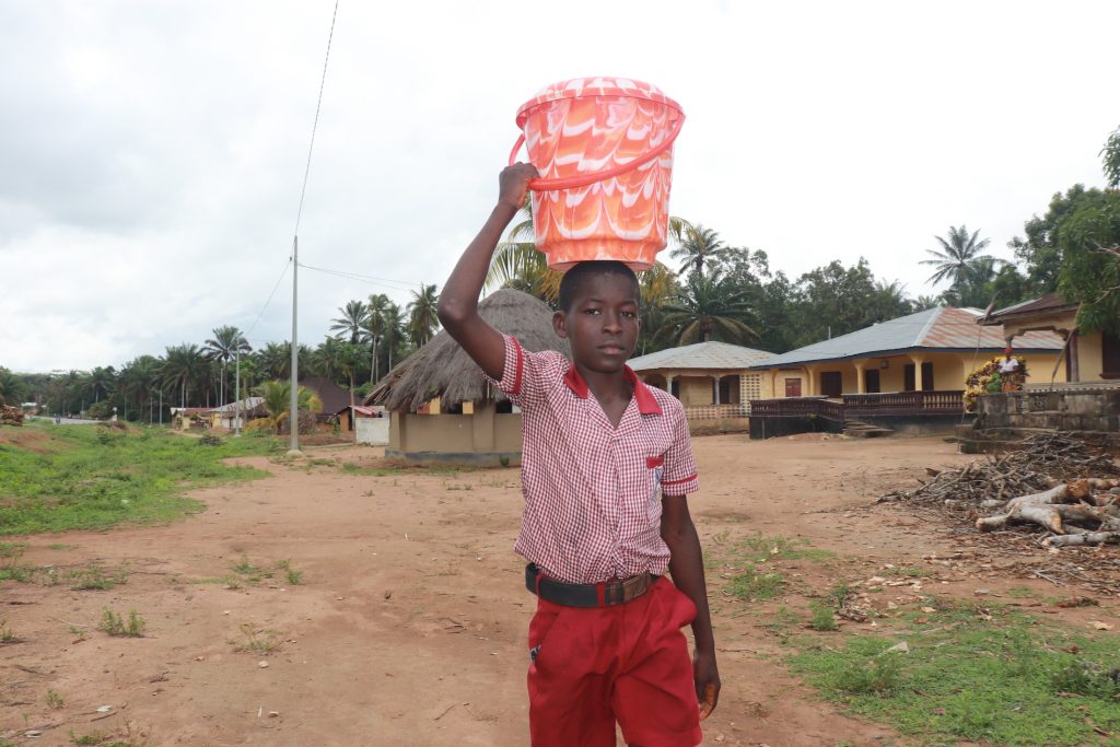 The Water Project : sierraleone21573-student-carrying-water-2