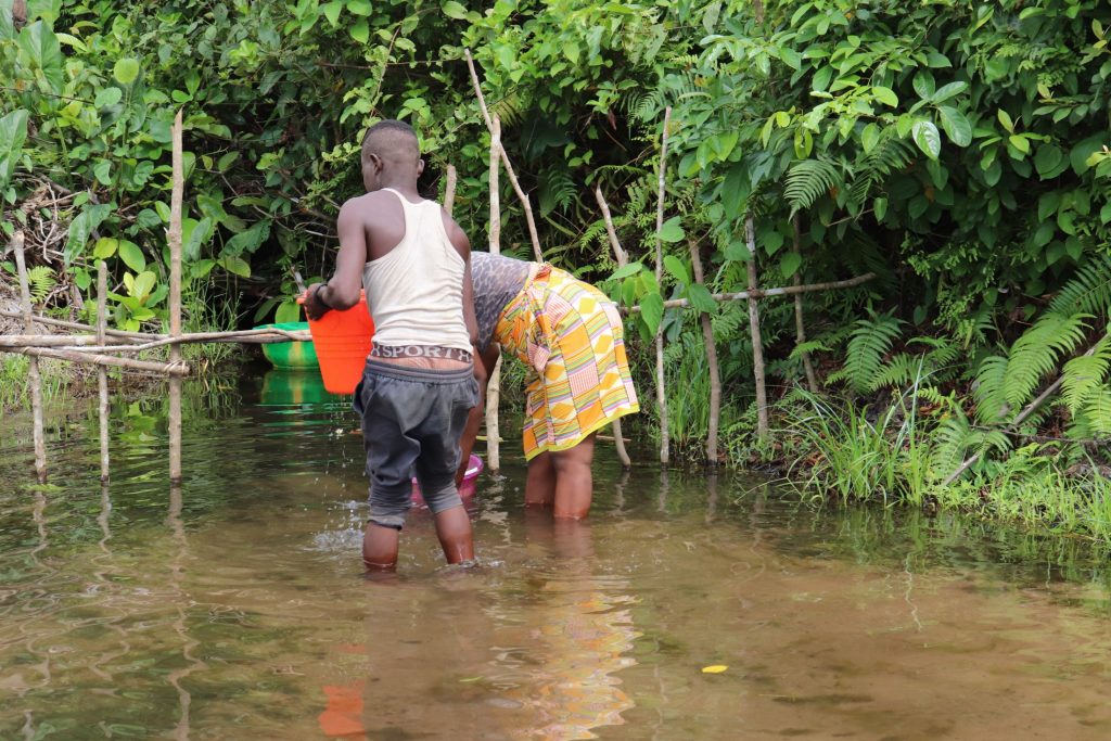 The Water Project : sierraleone21557-community-members-collecting-water-2