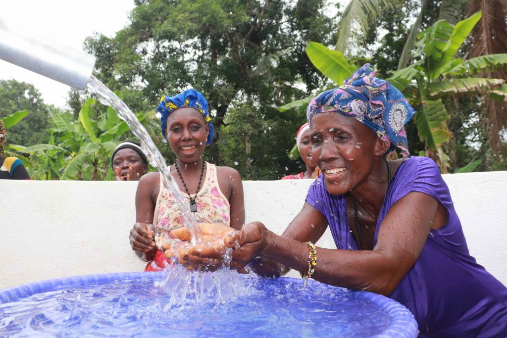 The Water Project : sierraleone21527-water-flowing-in-her-hands-2