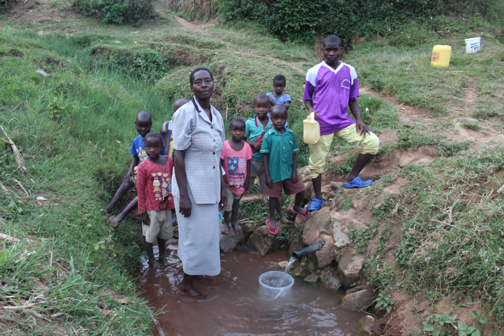 The Water Project : kenya20166-community-members-fetching-water