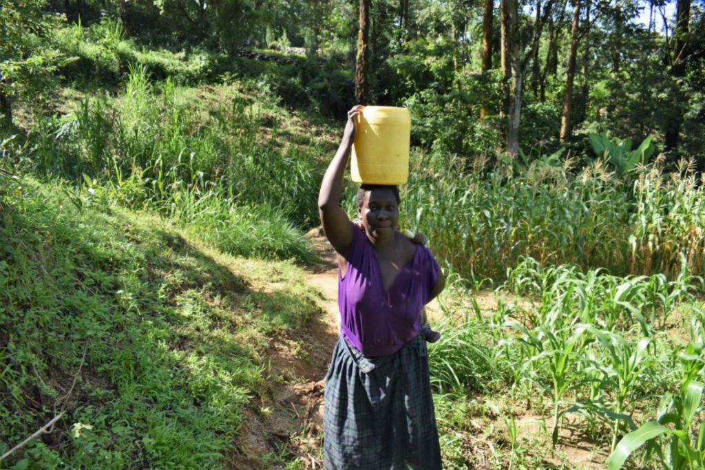 The Water Project : kenya22106-tecla-carrying-water1