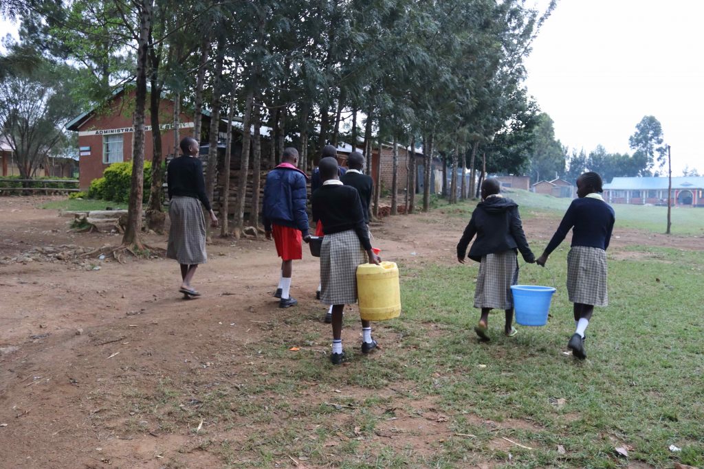 The Water Project : kenya22220-pupils-carrying-water-1