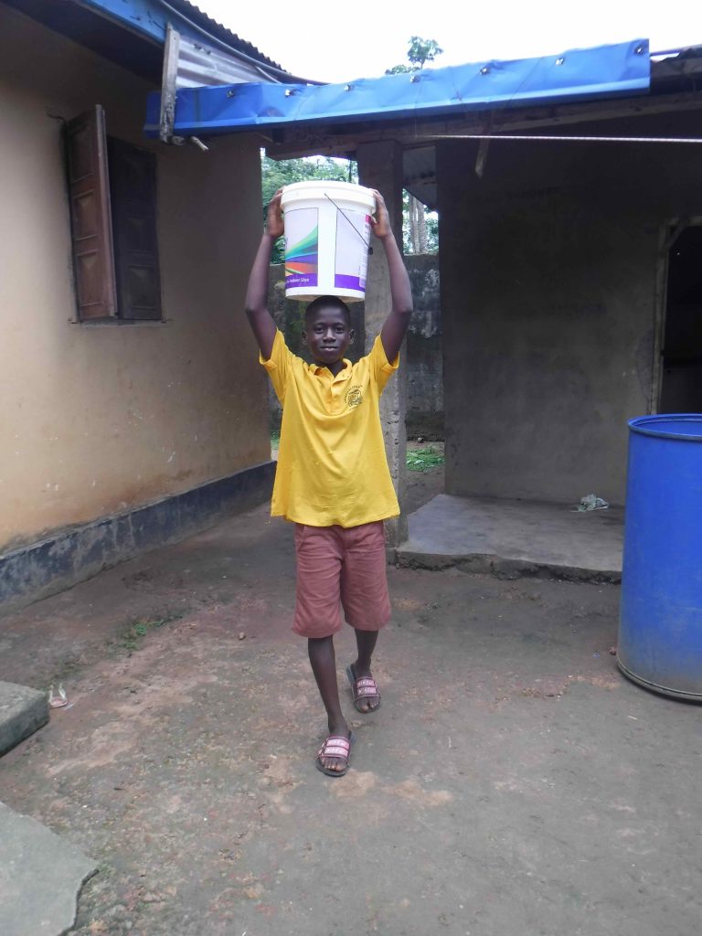 The Water Project : sierraleone22613-lamin-carrying-water