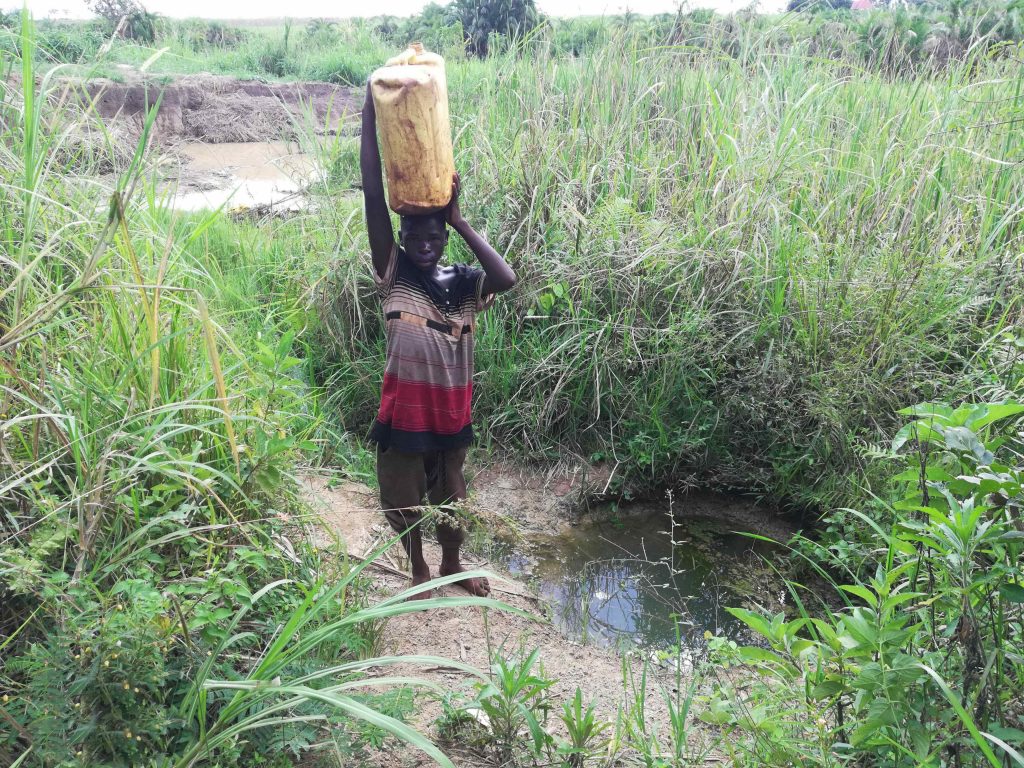 The Water Project : uganda22709-carrying-water-home-3
