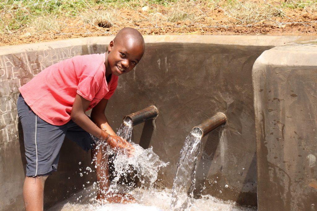 The Water Project : kenya21075-6-john-splashing-4