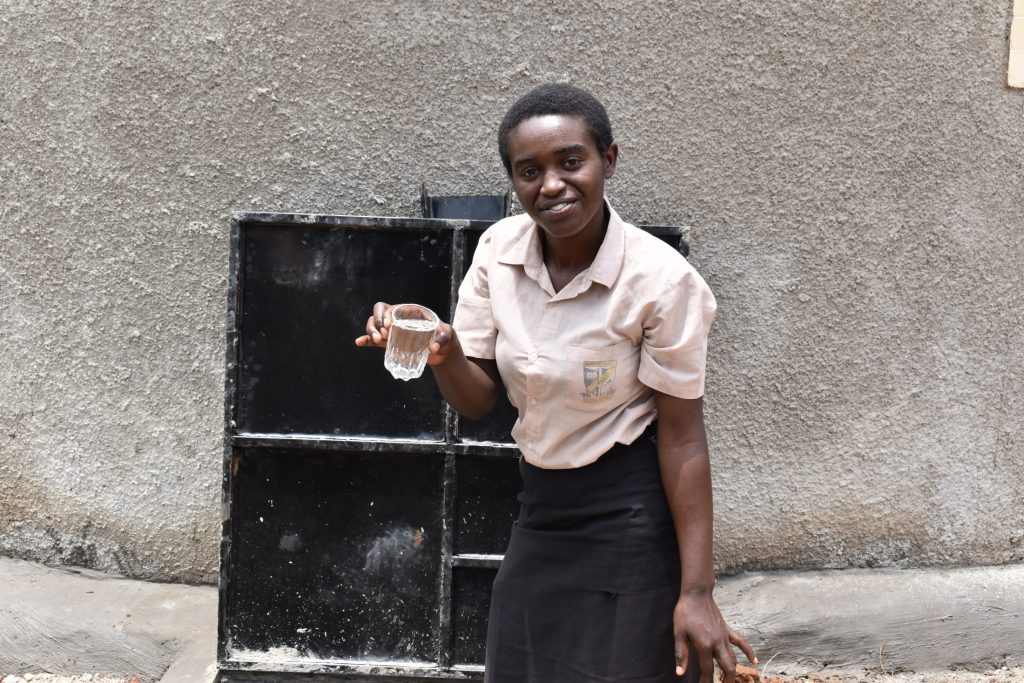 The Water Project : kenya21260-adisa-displays-clean-water