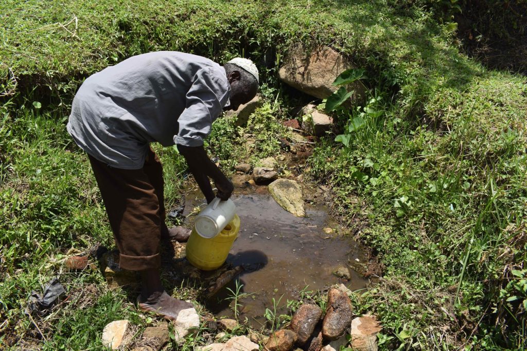 The Water Project : kenya22044-ayub-mwaka-fetching-water-5