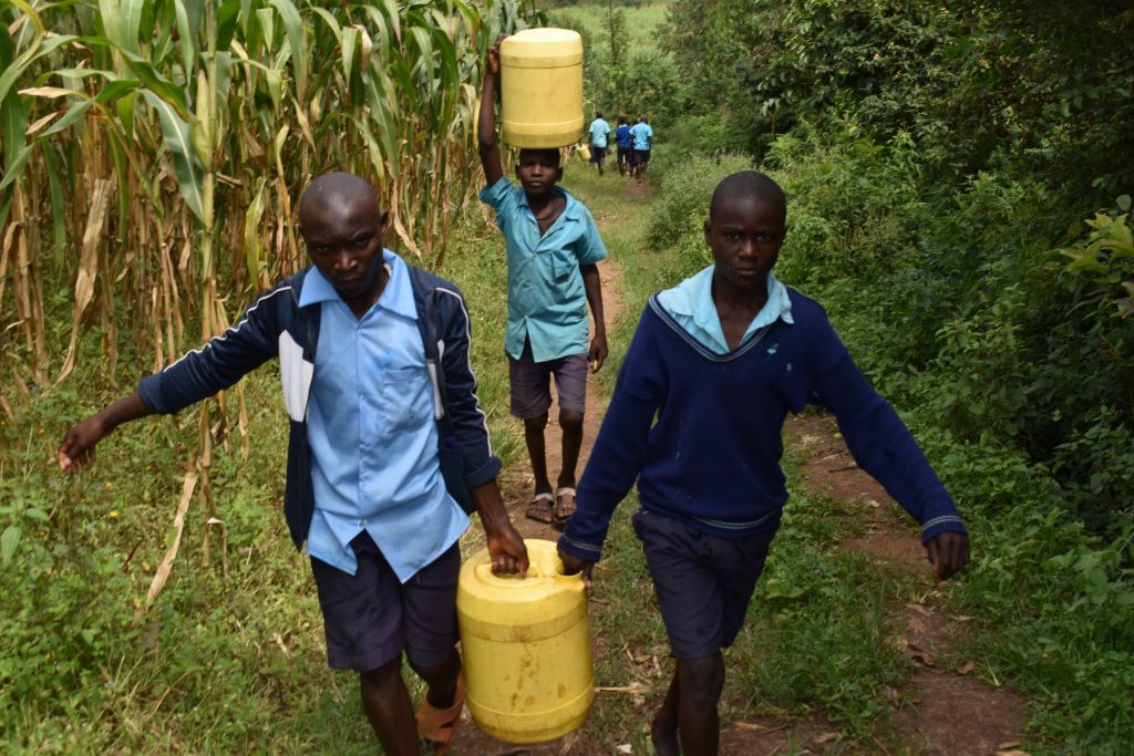 The Water Project : kenya22245-ferrying-water-to-school-2