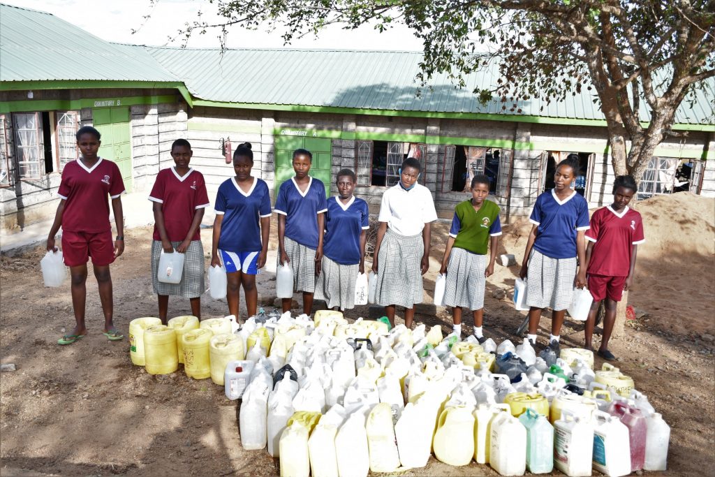 The Water Project : kenya22580-students-carrying-water-jerrycans-4
