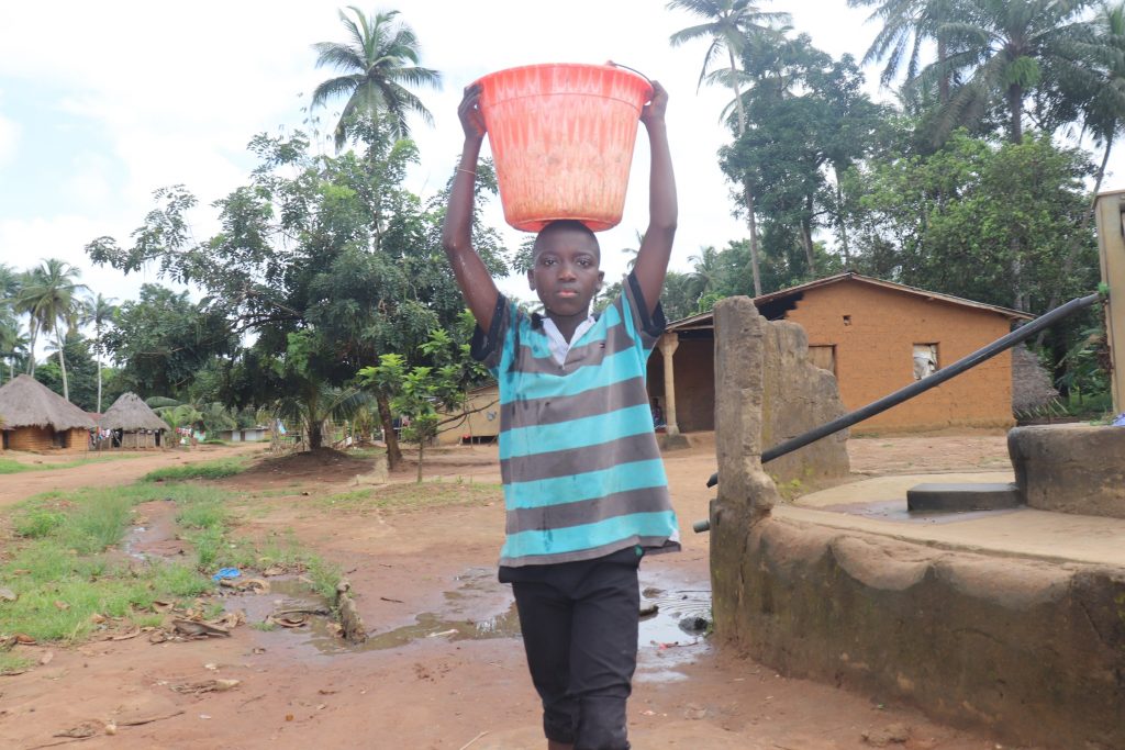 The Water Project : sierraleone22621-boy-carrying-water