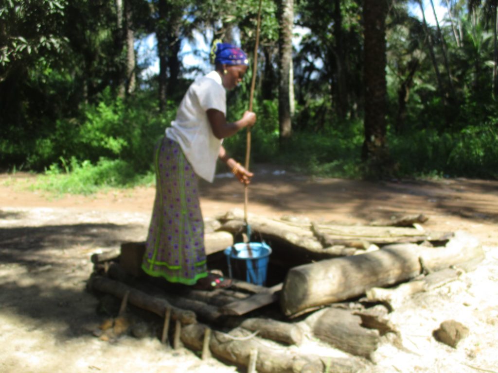 The Water Project : sierraleone22632-woman-collecting-water