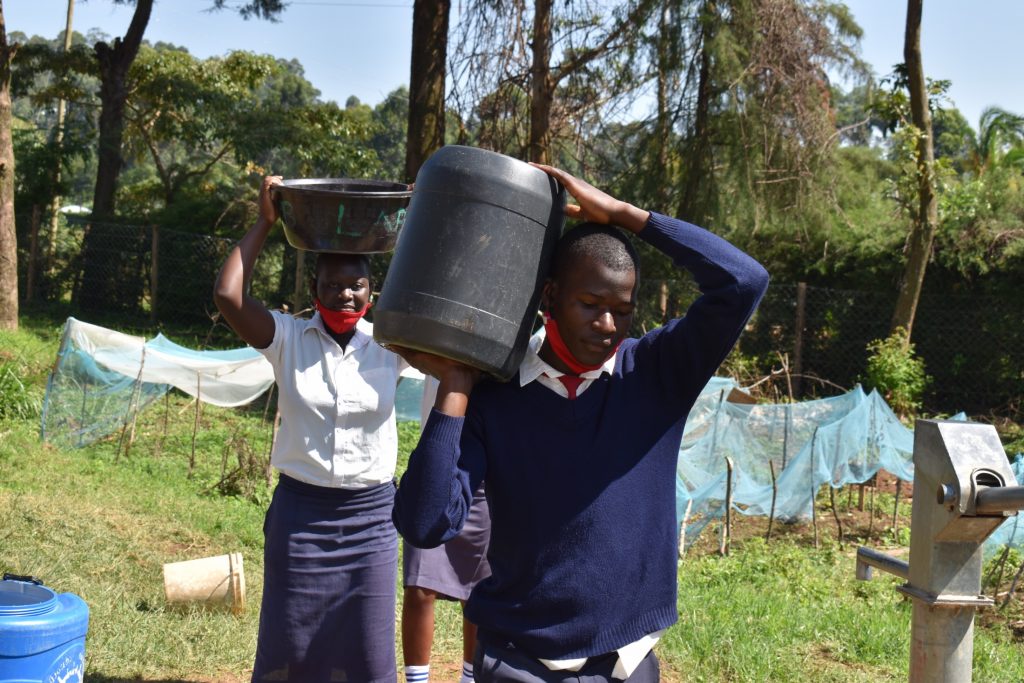 The Water Project : kenya22277-students-carrying-water-5