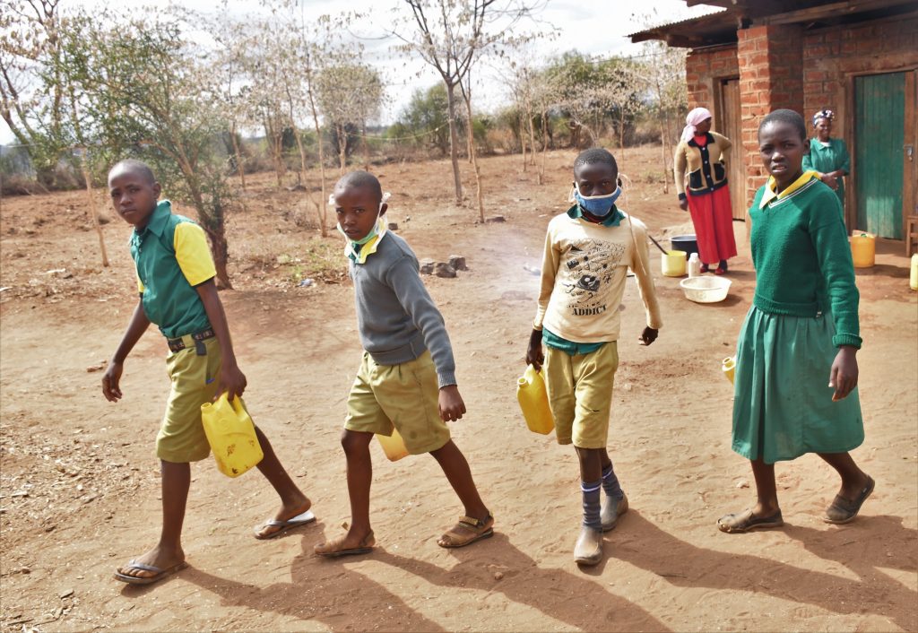 The Water Project : kenya22578-students-carrying-water-1