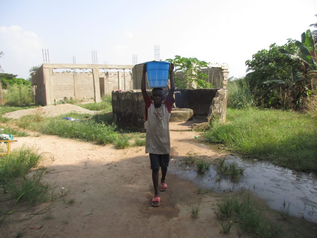 The Water Project : sierraleone22665-small-boy-carrying-water-2