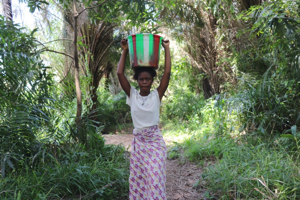 The Water Project : sierraleone22642-aminata-carrying-water-3