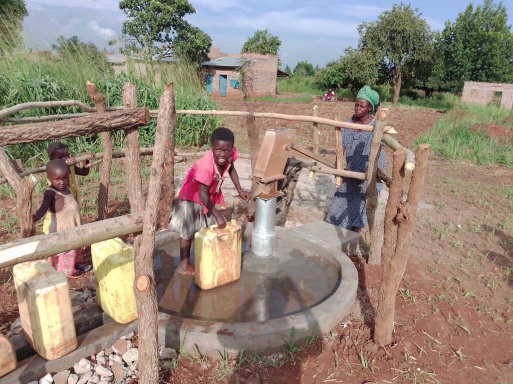 The Water Project : uganda21616-1-people-collecting-water-3