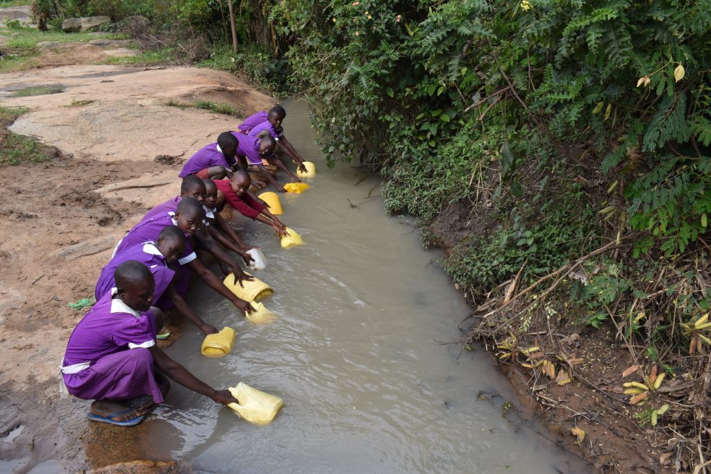 The Water Project : kenya22275-pupils-fetching-water-3