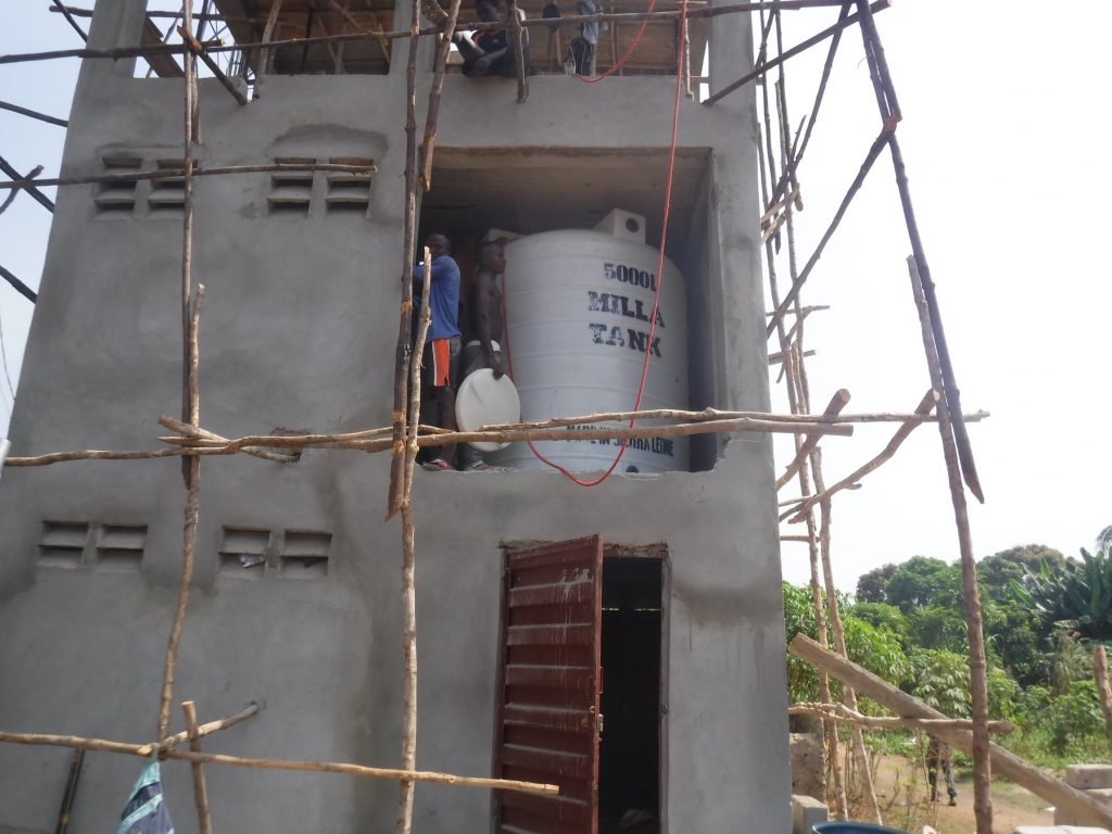 The Water Project : sierraleone21575-construction-of-the-solar-wall-10