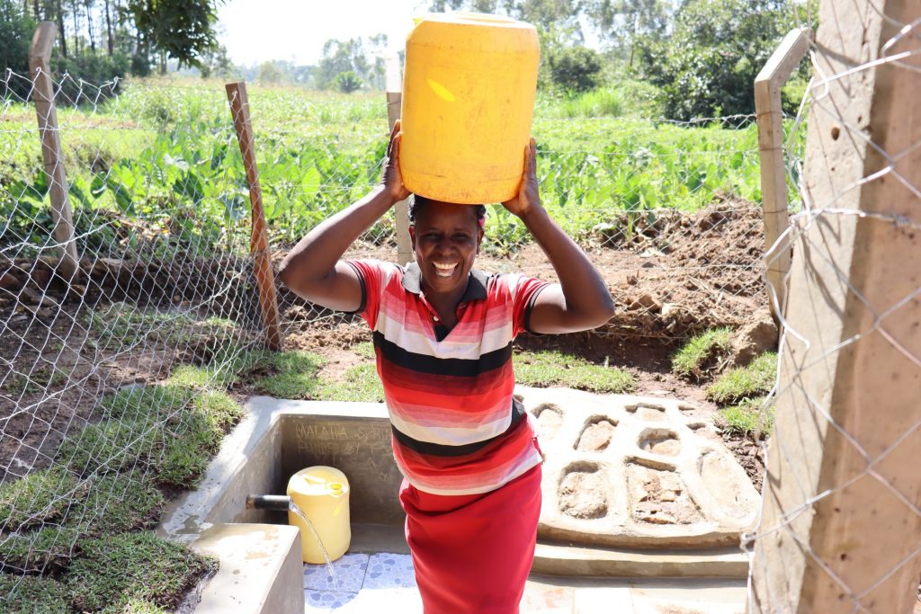 The Water Project : kenya22089-1-1-julia-carrying-water-2