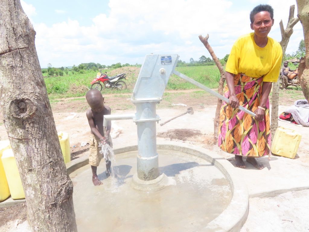The Water Project : uganda22701-1-people-drinking-and-splashing-52