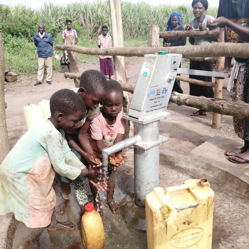 The Water Project : uganda21614-0-children-drinking-water-2