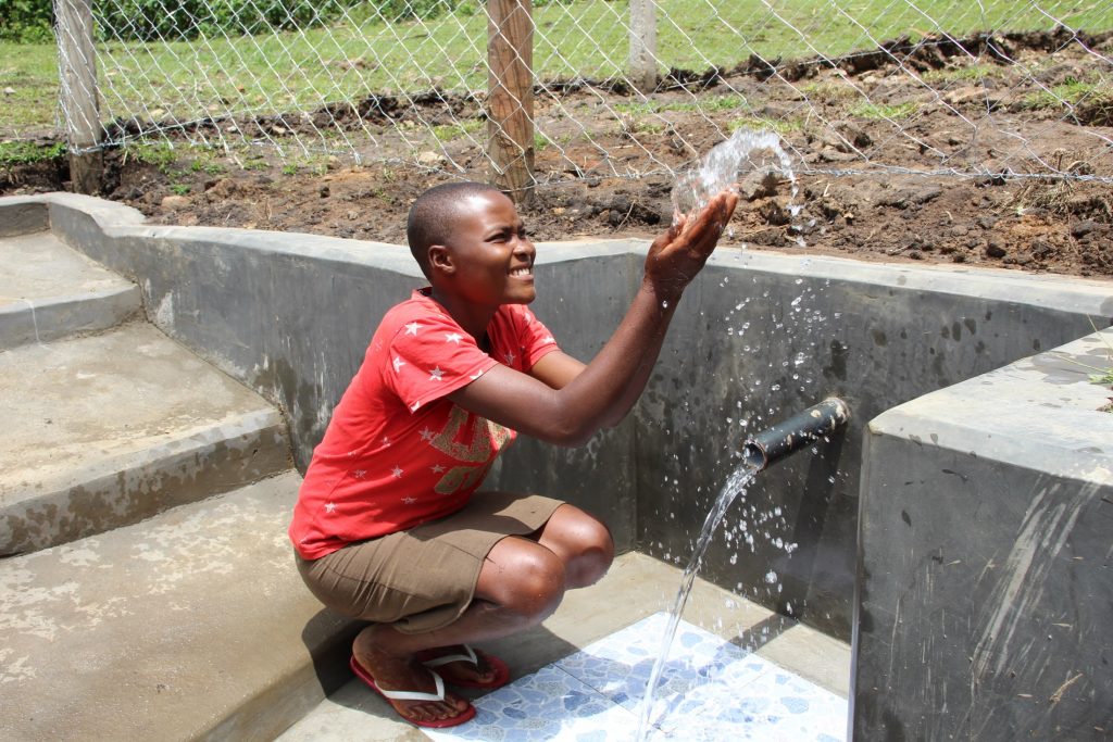 The Water Project : kenya22121-0-splashing-water-3