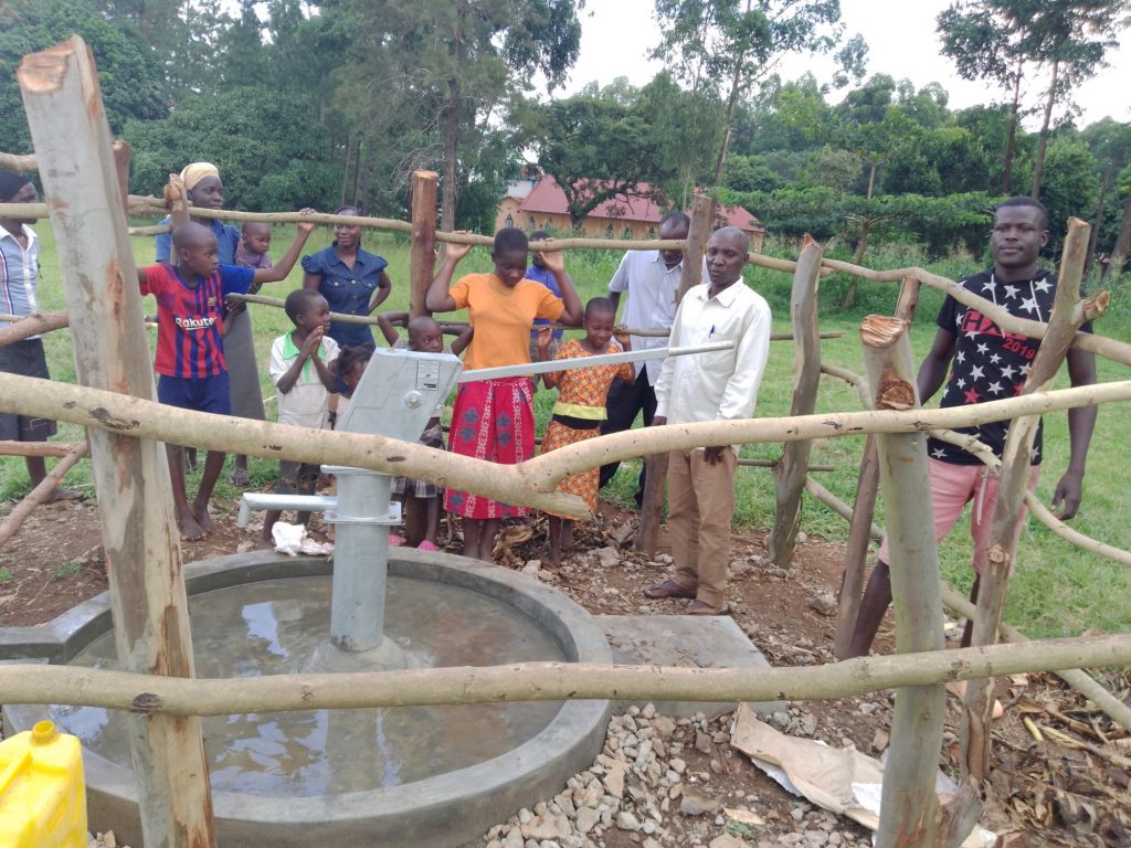 The Water Project : uganda21612-0-people-at-water-source-2