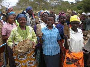 Women assisting in clean water project. 